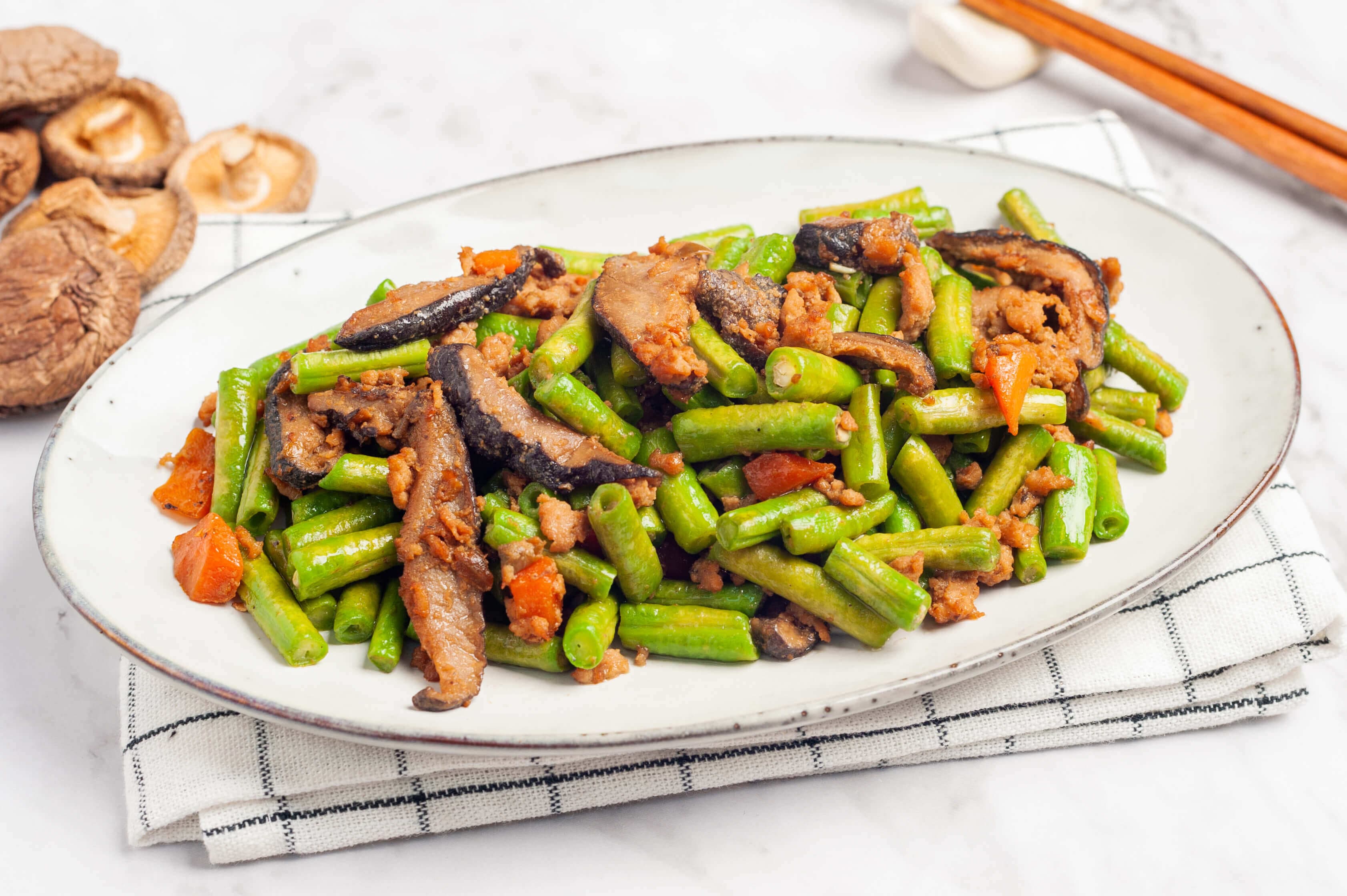 Stir-fried long beans with minced meat and shiitake mushrooms