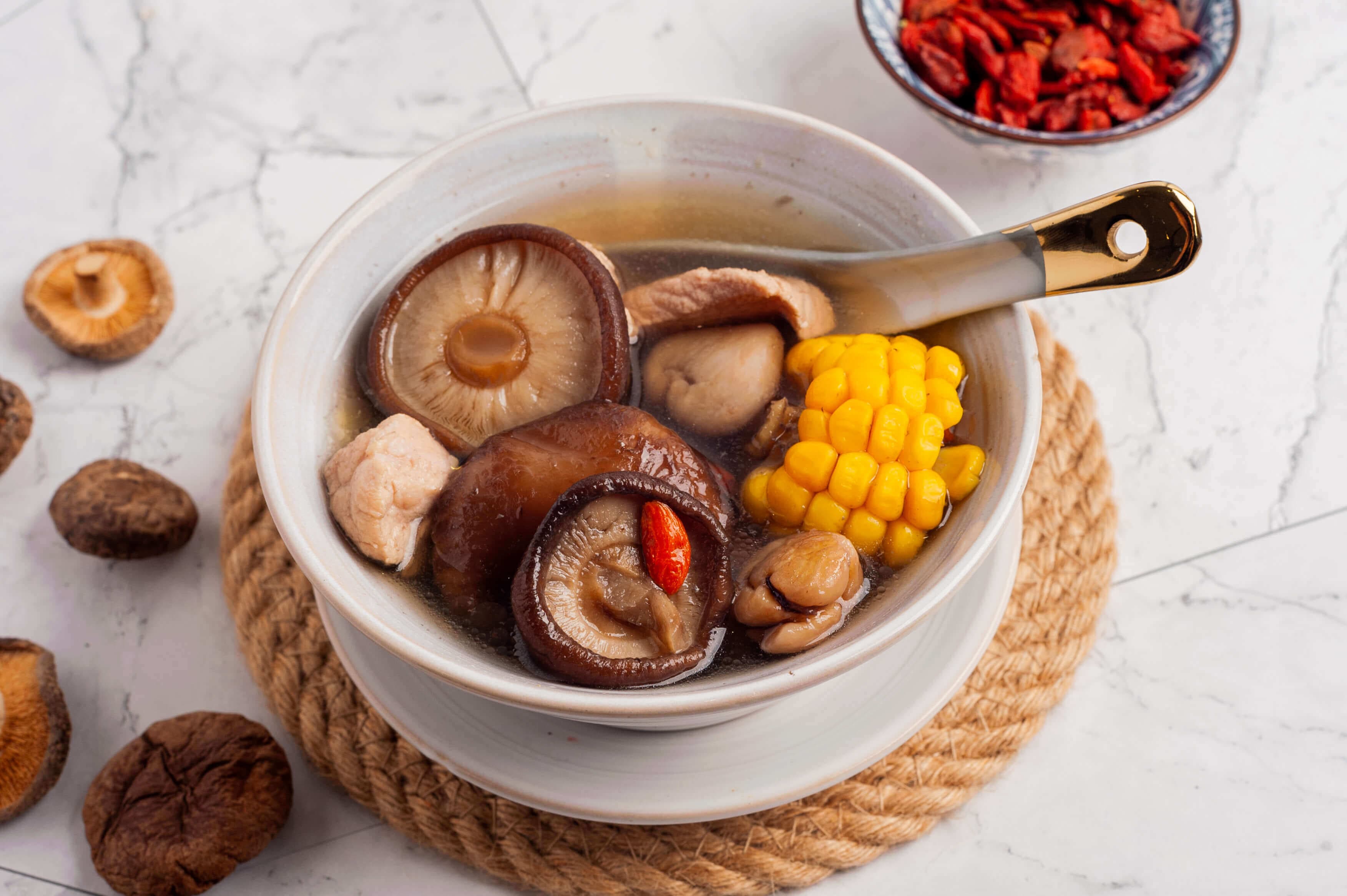 Shiitake mushroom and sweet corn pork rib soup in a bowl