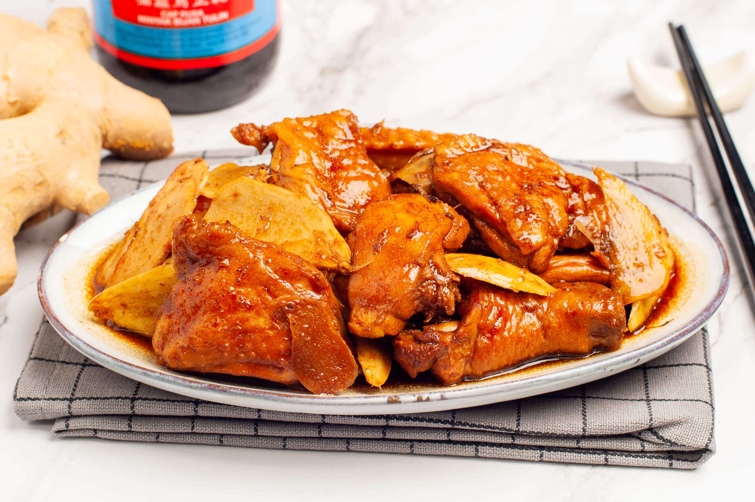 Stir-fry chicken with sesame oil and ginger